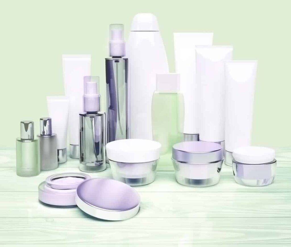 cosmetic containers located on a white wooden background.