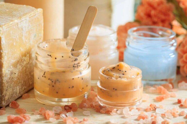 variety of creams and bath salt on wooden background